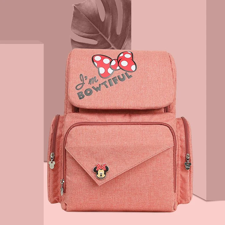 Coral Minnie Bow Diaper Backpack with Top flap, Side zip pockets and Front envelope pocket · view 1