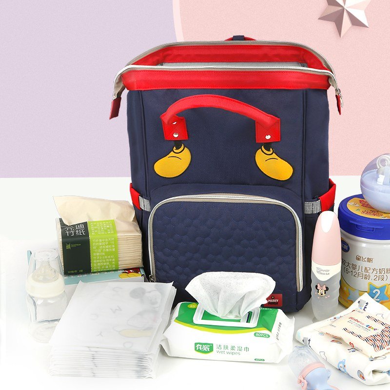 Navy and Red Face-Patch Backpack with Twin Handles, Wide Top Opening, Side Pockets and Rear Zip Pocket · enlarged view 1